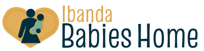 Logo for Ibanda Babies Home with the text in orange and navy-blue. Nex to the logo is an abstract graphic that shows a silhouette of a woman holding a baby inside of a yellow-orange heart.
